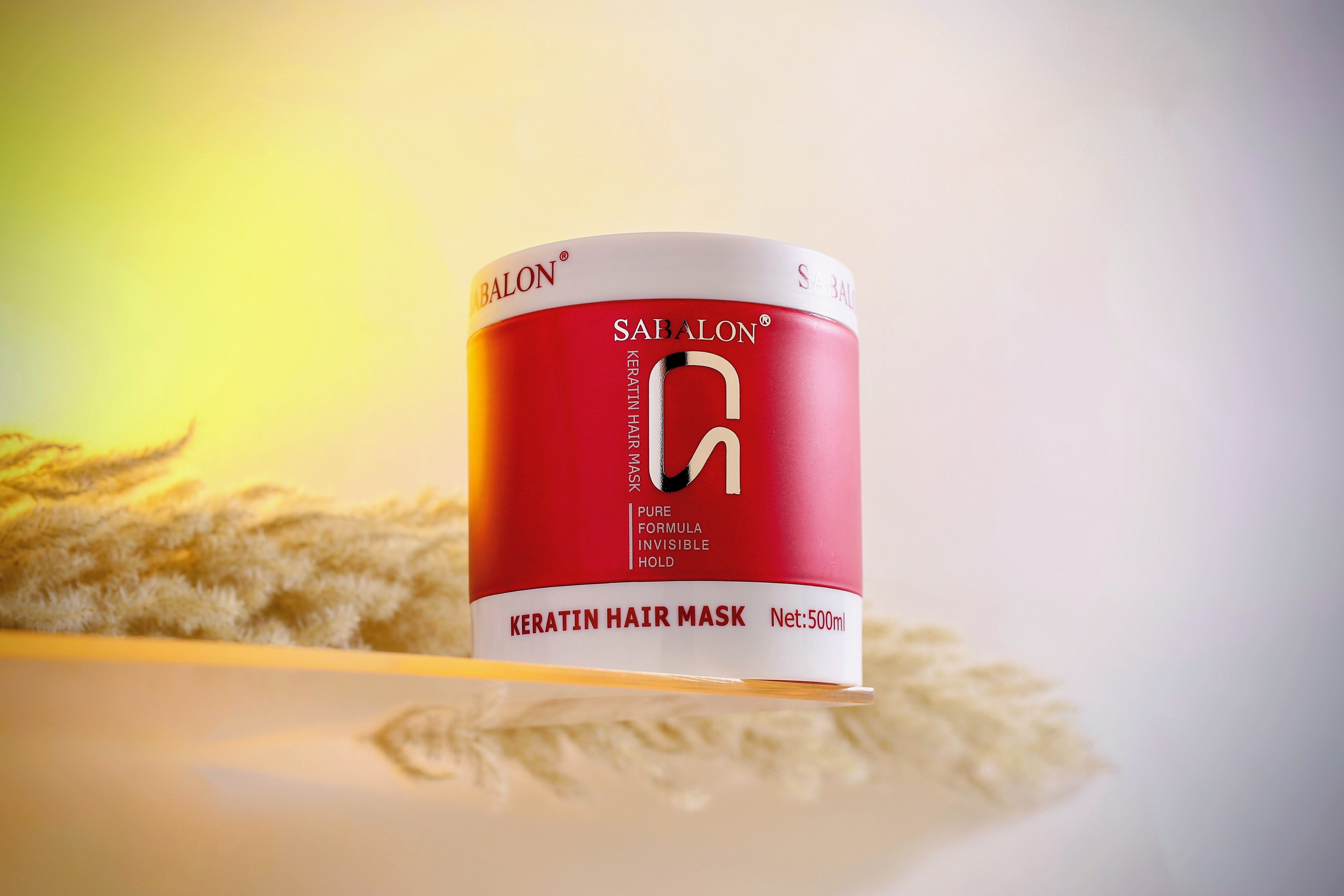 Sabalon keratin hair mask jar on soft textured background
